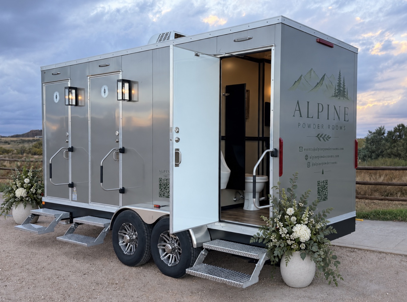 Alpine Powder Rooms luxury restroom trailer at dusk with mountain backdrop